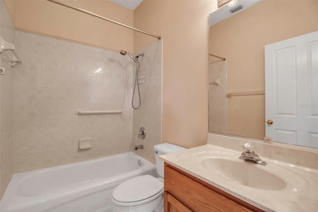 full bathroom with vanity, toilet, and tiled shower / bath combo