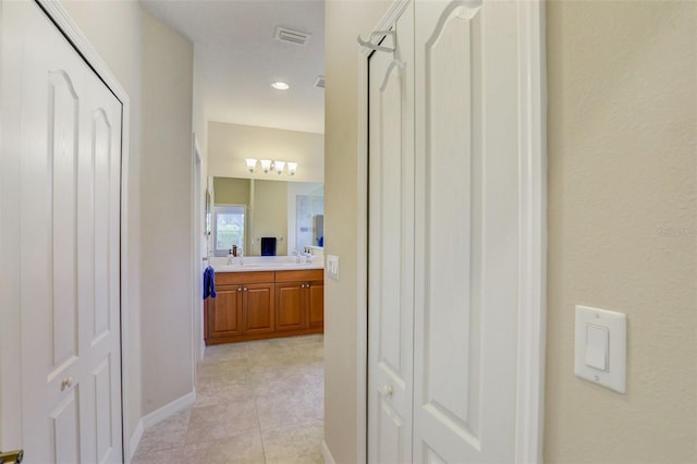 hallway featuring light tile patterned floors