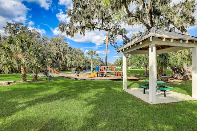 view of property's community with a playground, a gazebo, and a yard