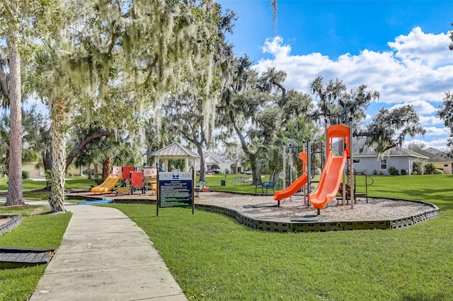 view of playground with a yard