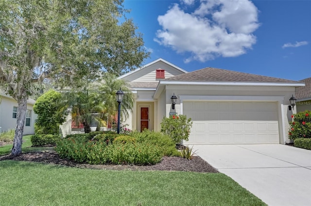 ranch-style home with a front lawn and a garage