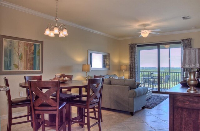 7005 River Hammock Dr Unit 404, Bradenton, FL 34212 - dining area with visible vents, ornamental molding, light tile patterned floors, and ceiling fan with notable chandelier