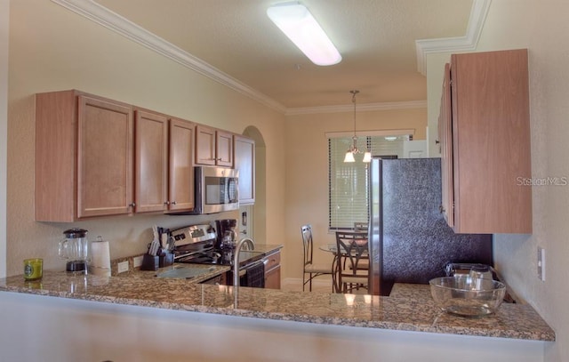 kitchen featuring ornamental molding, stainless steel appliances, light stone counters, and decorative light fixtures