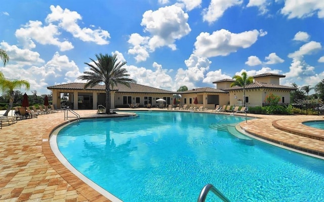 7005 River Hammock Dr Unit 404, Bradenton, FL 34212 - community pool featuring a patio