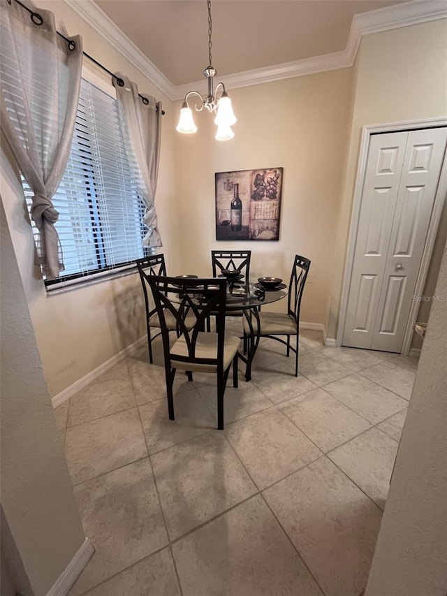 tiled dining room featuring ornamental molding and an inviting chandelier