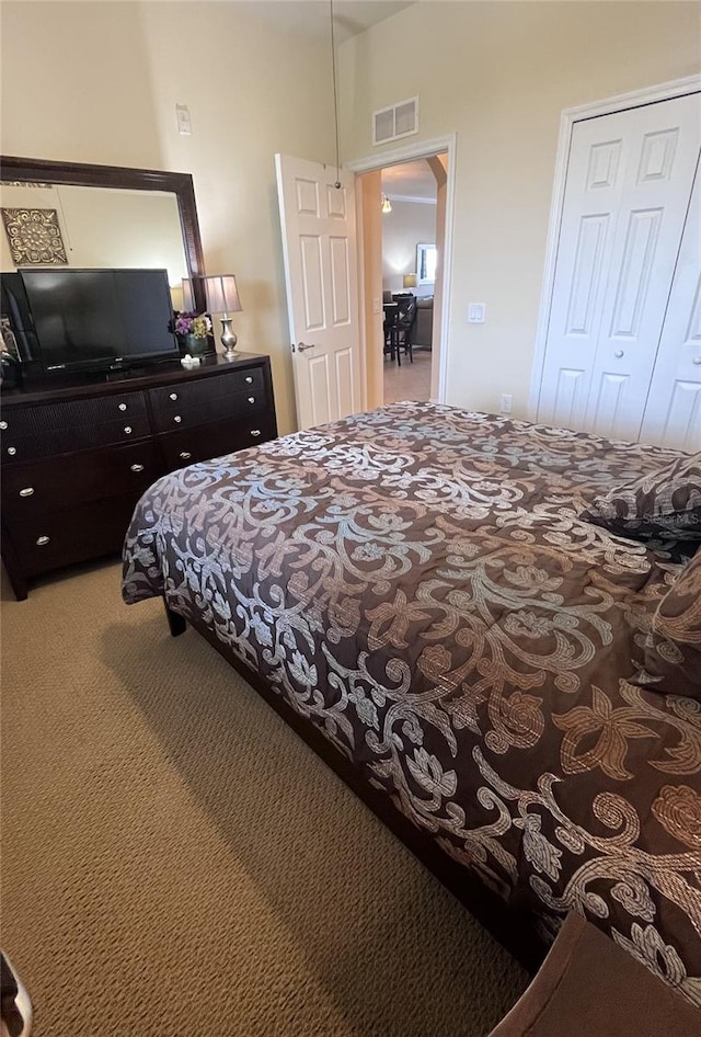 bedroom with carpet flooring and a closet