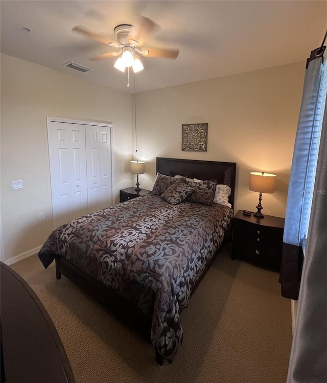 bedroom with a closet, ceiling fan, and carpet floors