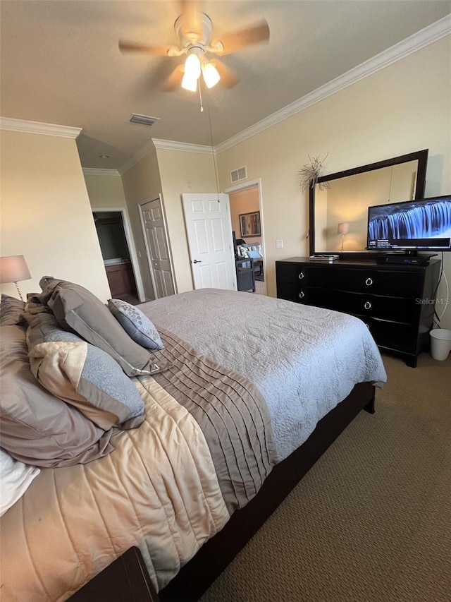 carpeted bedroom with ceiling fan and ornamental molding