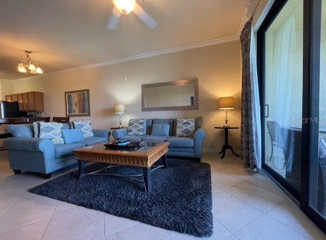 7005 River Hammock Dr Unit 404, Bradenton, FL 34212 - living room featuring crown molding, baseboards, ceiling fan with notable chandelier, and light tile patterned flooring