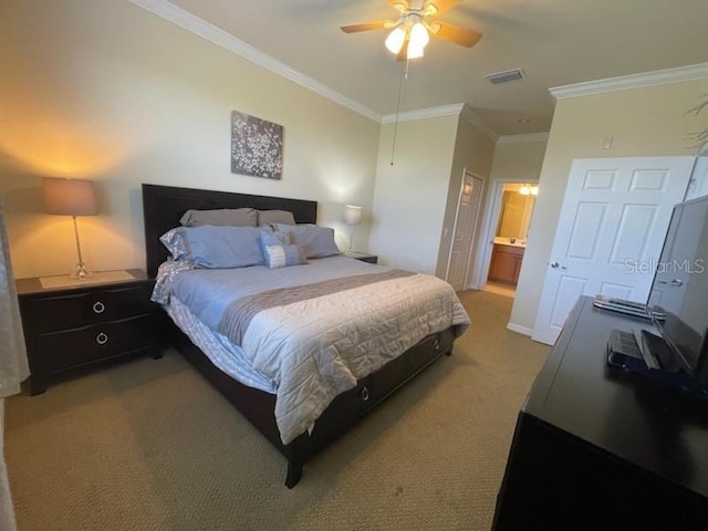 7005 River Hammock Dr Unit 404, Bradenton, FL 34212 - bedroom featuring visible vents, a ceiling fan, ornamental molding, carpet flooring, and ensuite bath