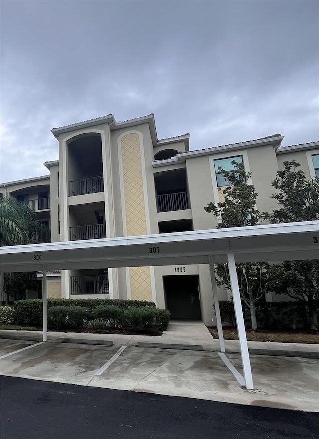 7005 River Hammock Dr Unit 404, Bradenton, FL 34212 - view of property with covered parking