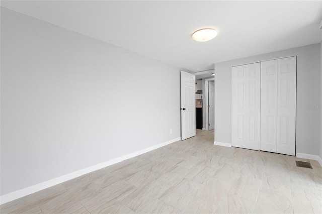 unfurnished bedroom featuring a closet