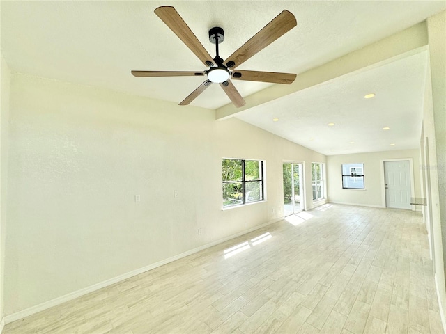 unfurnished living room with a textured ceiling, ceiling fan, light wood-type flooring, and vaulted ceiling with beams