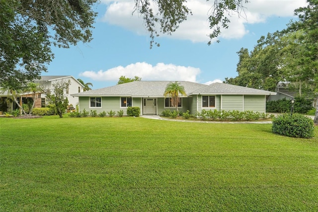 ranch-style home with a front lawn