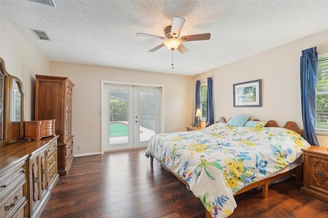 bedroom with ceiling fan, access to outside, french doors, a textured ceiling, and dark hardwood / wood-style flooring