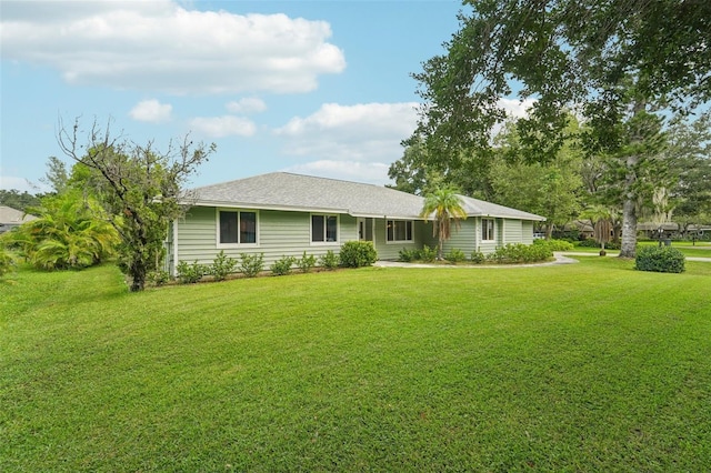 single story home featuring a front yard