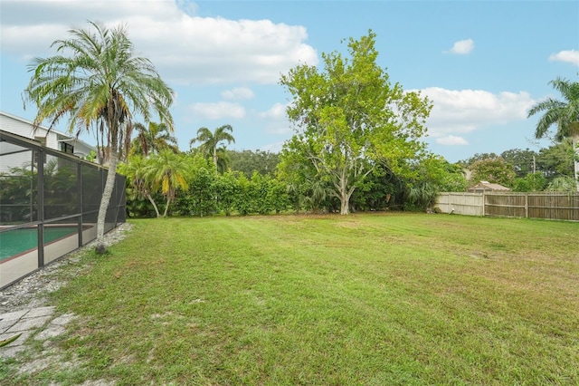 view of yard featuring a fenced in pool