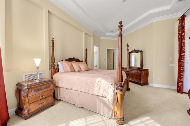 bedroom featuring light carpet, crown molding, and a raised ceiling