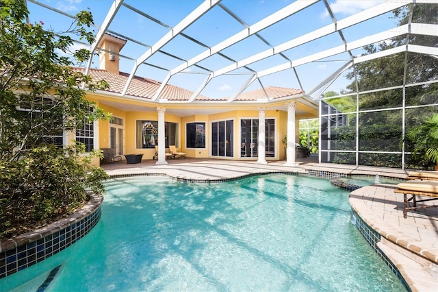 view of pool with a lanai and a patio area