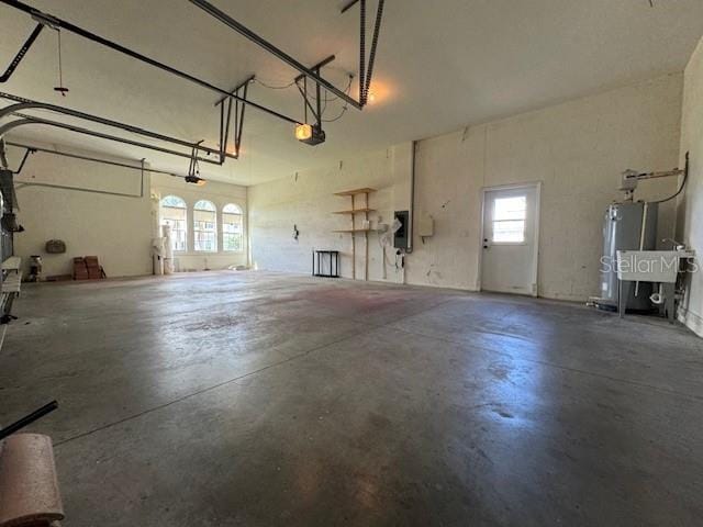 111 172nd St E, Bradenton, FL 34212 - garage featuring a garage door opener and gas water heater