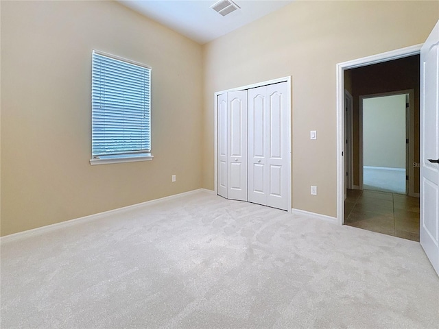 111 172nd St E, Bradenton, FL 34212 - unfurnished bedroom featuring carpet, a closet, and baseboards