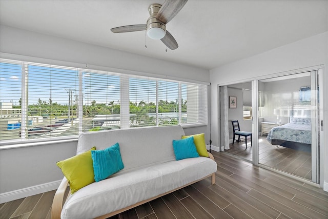 sitting room featuring ceiling fan and hardwood / wood-style flooring