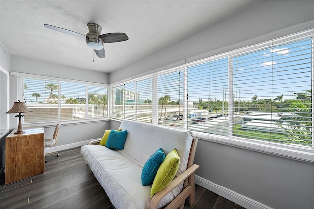 sunroom with a healthy amount of sunlight and ceiling fan