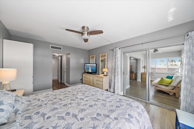 bedroom featuring ceiling fan, light hardwood / wood-style flooring, and a closet