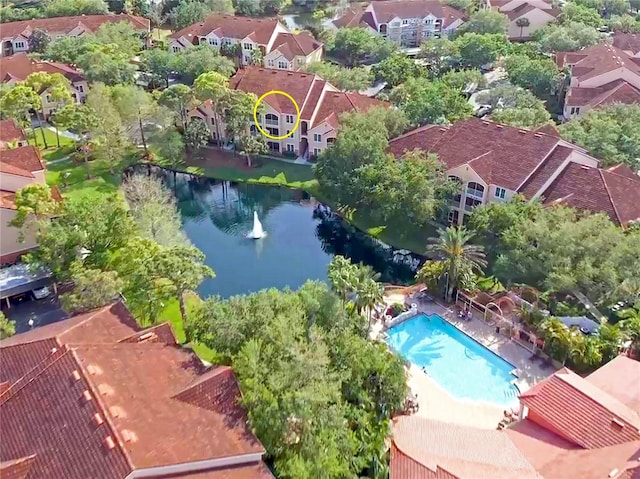 birds eye view of property featuring a water view