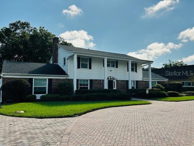 view of front of home with a front yard