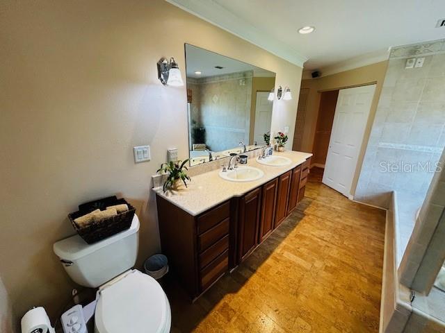 bathroom featuring toilet and vanity