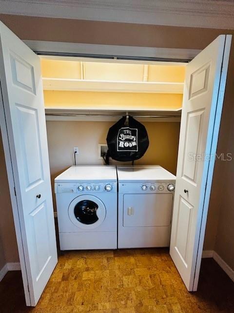 washroom featuring washer and dryer