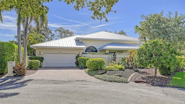 view of front of property with a garage