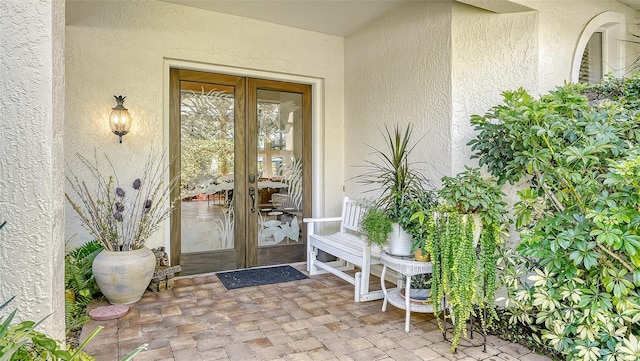 property entrance featuring french doors