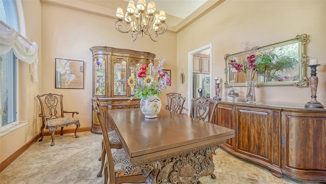 dining area featuring a notable chandelier