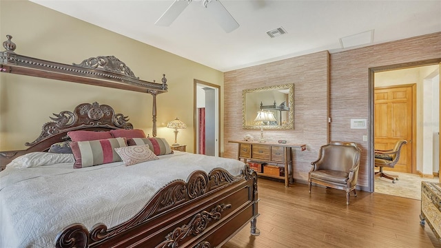 bedroom with ceiling fan and hardwood / wood-style flooring