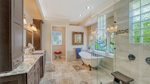 bathroom featuring vanity and plus walk in shower