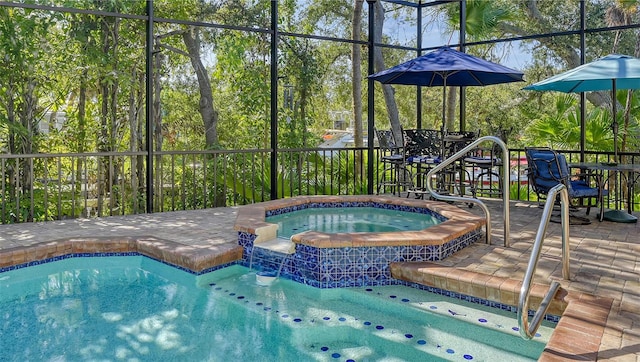 view of pool with an in ground hot tub