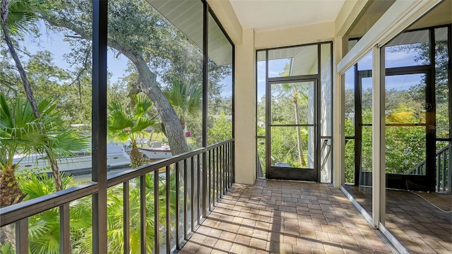 unfurnished sunroom featuring a wealth of natural light