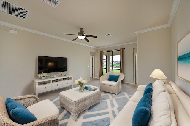 living room featuring ornamental molding and ceiling fan