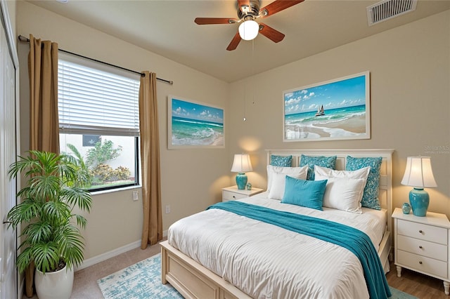 bedroom featuring ceiling fan and carpet floors