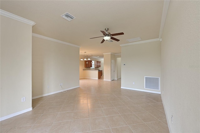 unfurnished room with ceiling fan with notable chandelier, ornamental molding, and light tile patterned floors