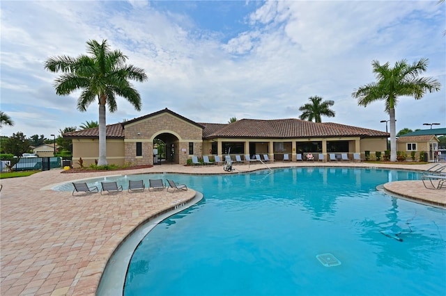 view of swimming pool featuring a patio area