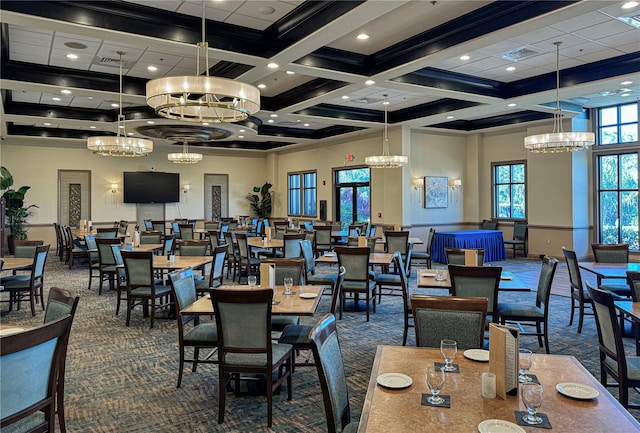 carpeted dining area featuring a high ceiling, beamed ceiling, and coffered ceiling