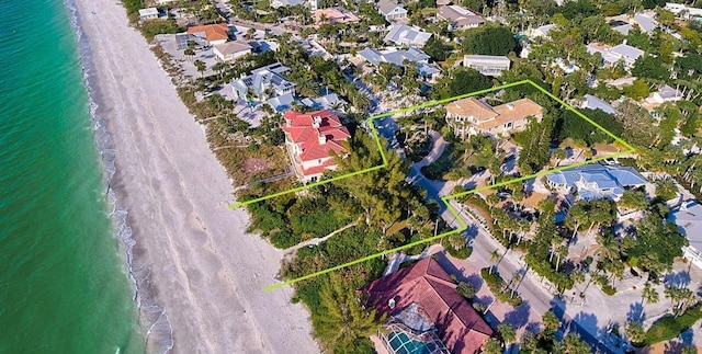 aerial view with a beach view and a water view