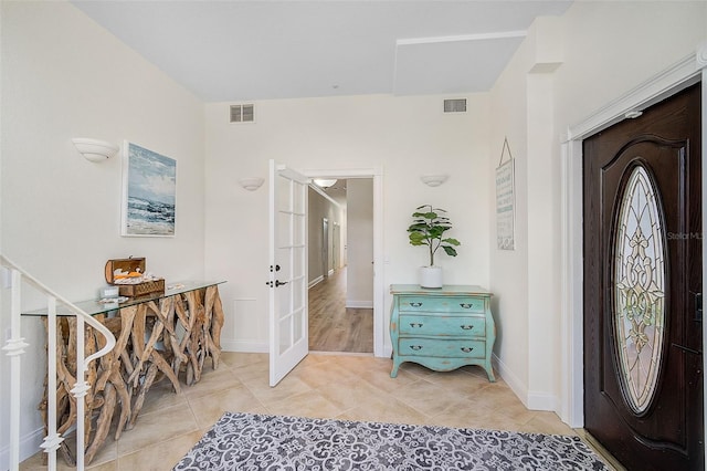 foyer entrance with light tile patterned flooring