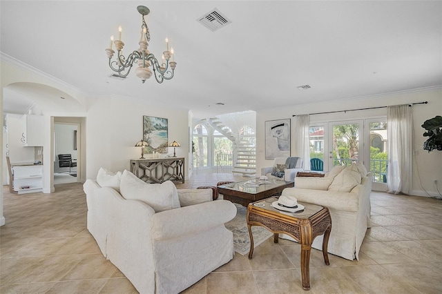 living room featuring a notable chandelier, crown molding, and light tile patterned floors