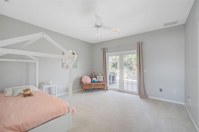 bedroom featuring access to outside, light carpet, ceiling fan, and french doors