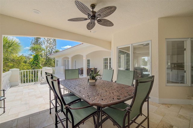 view of patio featuring ceiling fan