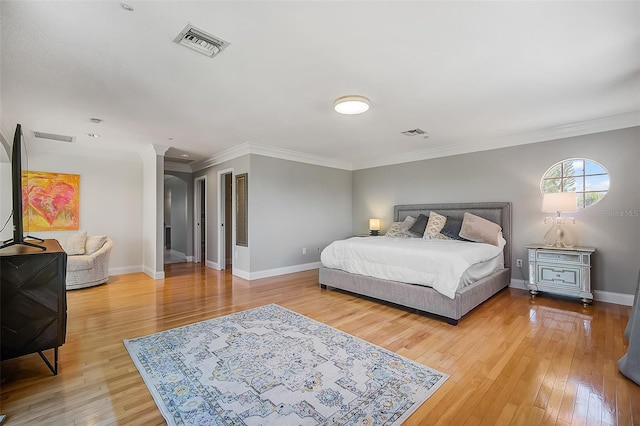 bedroom featuring crown molding and hardwood / wood-style floors